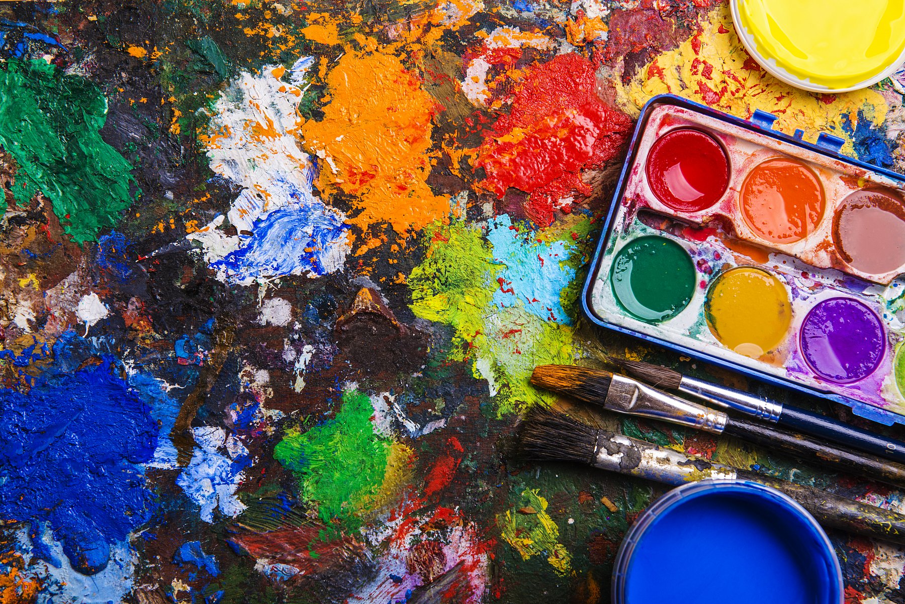 graphicstock-desk-of-an-artist-with-watercolor-paints-and-paintbrushes_rRLiWR6bZ.jpg